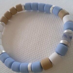 Bracelet...stretch bracelet with mini blue cloud center stone...7 1/2 inches